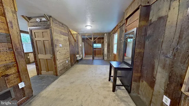 a view of a hallway with seating area