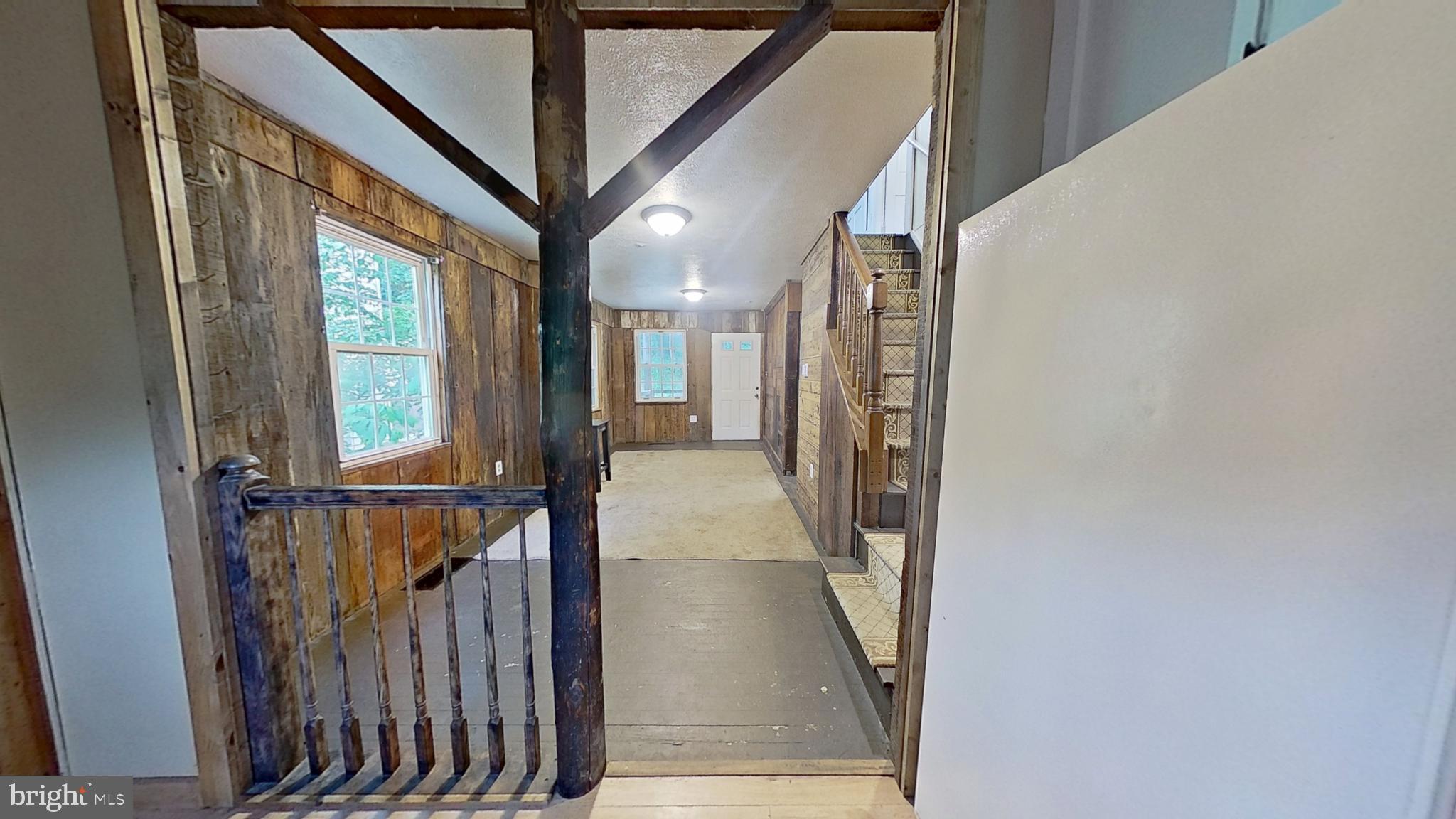 1961 Craley Road Windsor, PA 17366 - Photo 3 of 13 a view of a hallway with wooden floor and staircase