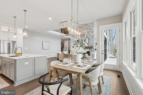 a kitchen with a dining table and chairs