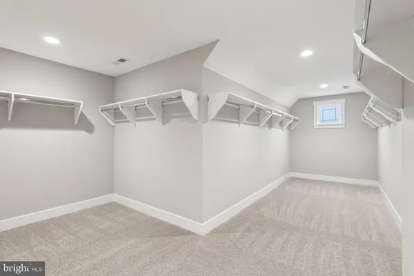 a view of an empty room with windows