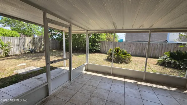 a view of a living room and floor to ceiling window