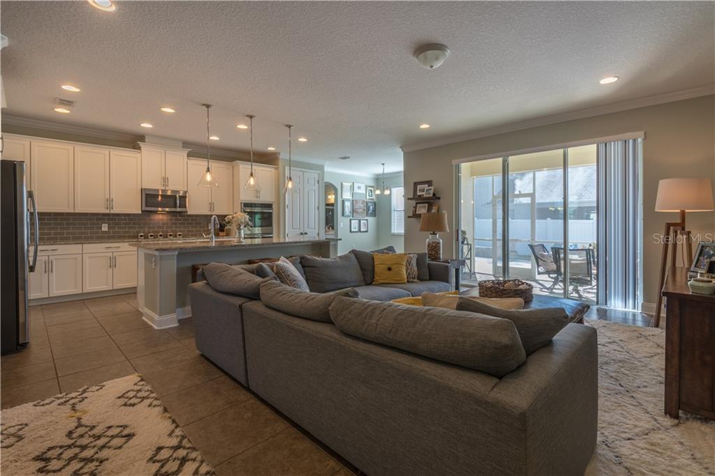 Great Room View showing Kitchen, Dinette & Sliders to Screened Porch