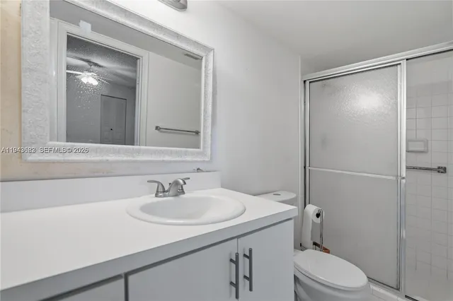 a bathroom with a sink toilet and vanity