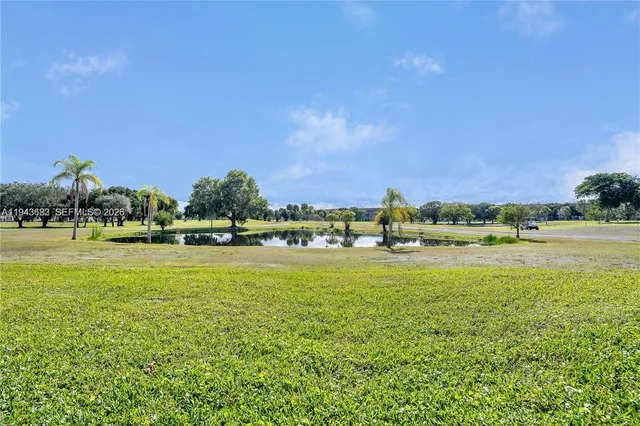 a view of a large body of water with a building in the background