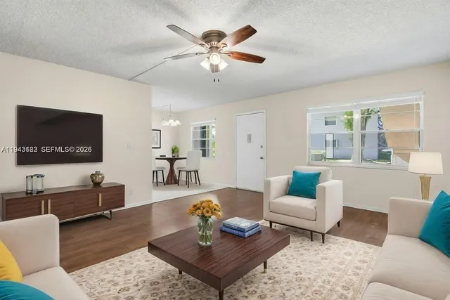 a living room with furniture and a flat screen tv