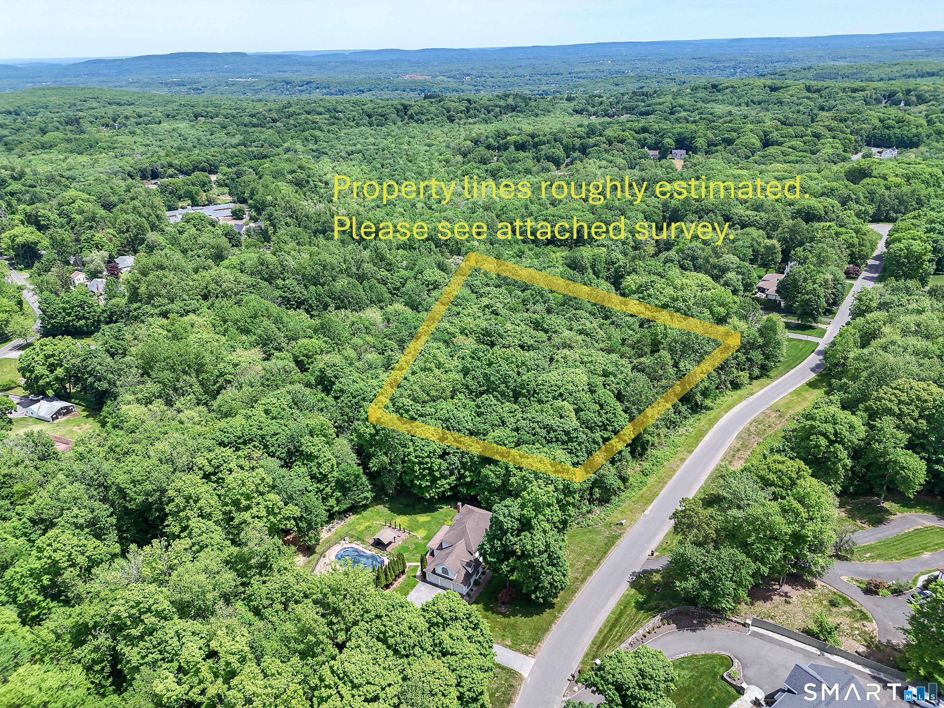 7 Holley Lane Prospect, CT 06712 - Photo 17 of 30 an aerial view of a house with a lush green forest