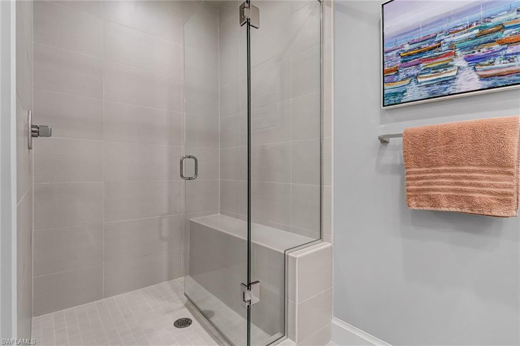 1111 Central Avenue, Unit 203 Naples, FL 34102 - Photo 13 of 19 a bathroom with a shower