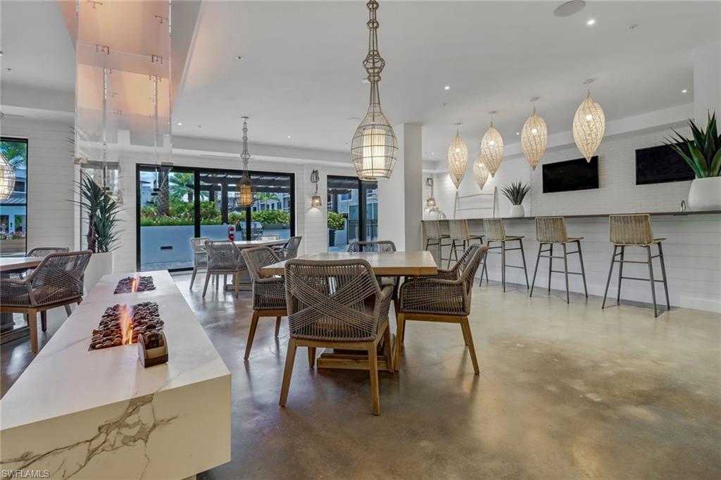1111 Central Avenue, Unit 203 Naples, FL 34102 - Photo 18 of 19 a view of a dining area with furniture
