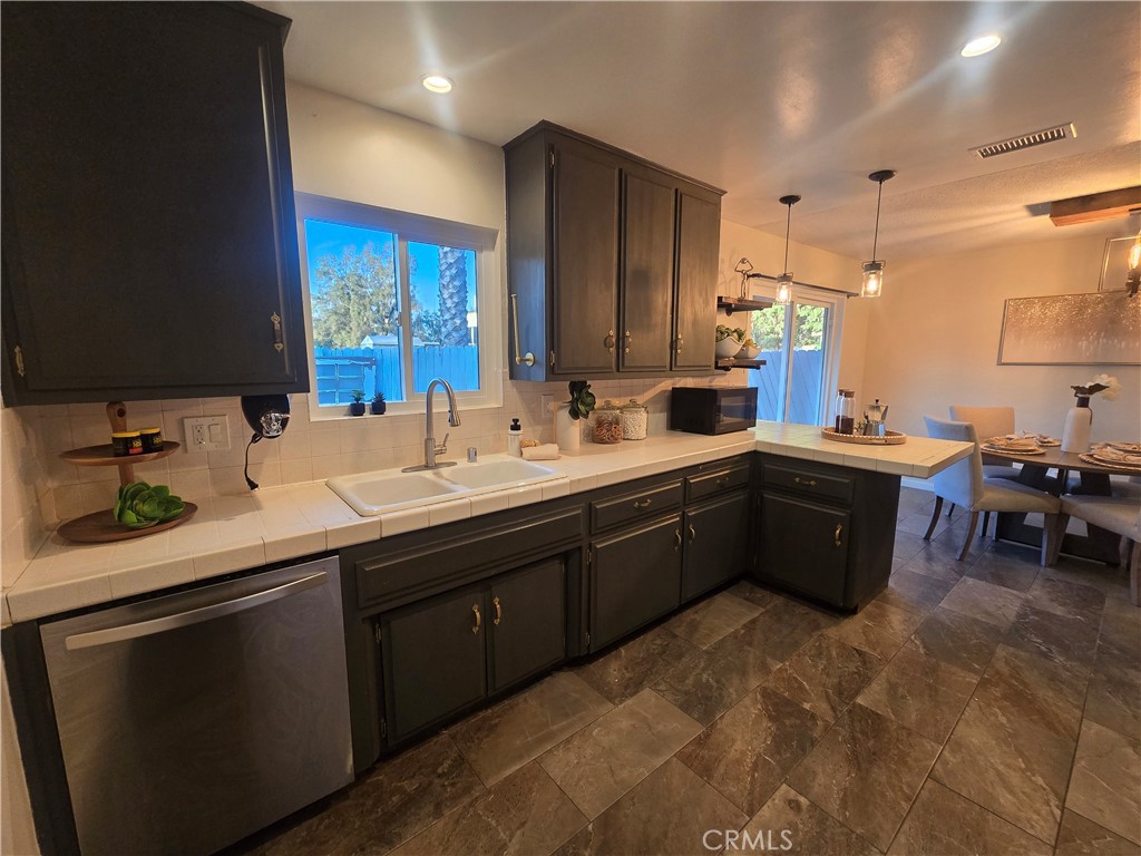 607 Sixth Street Norco, CA 92860 - Photo 11 of 31 a kitchen with a sink and cabinets