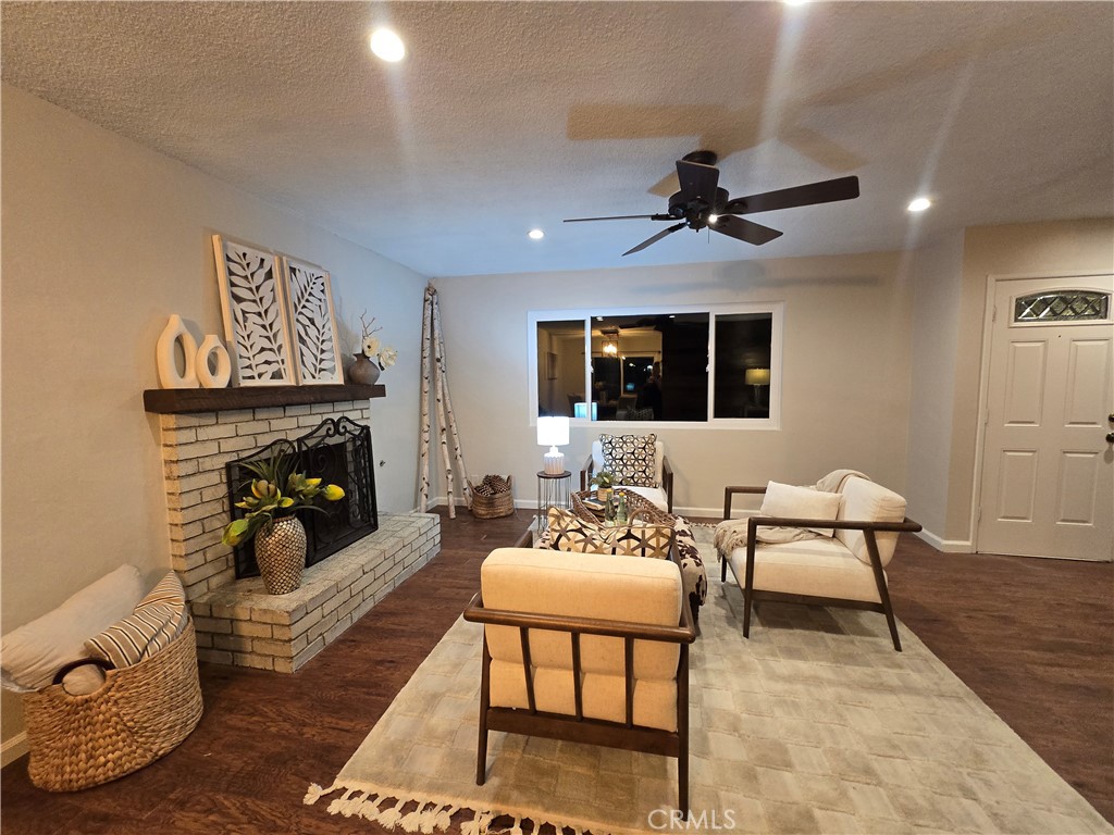 607 Sixth Street Norco, CA 92860 - Photo 13 of 31 a living room with furniture and a fireplace