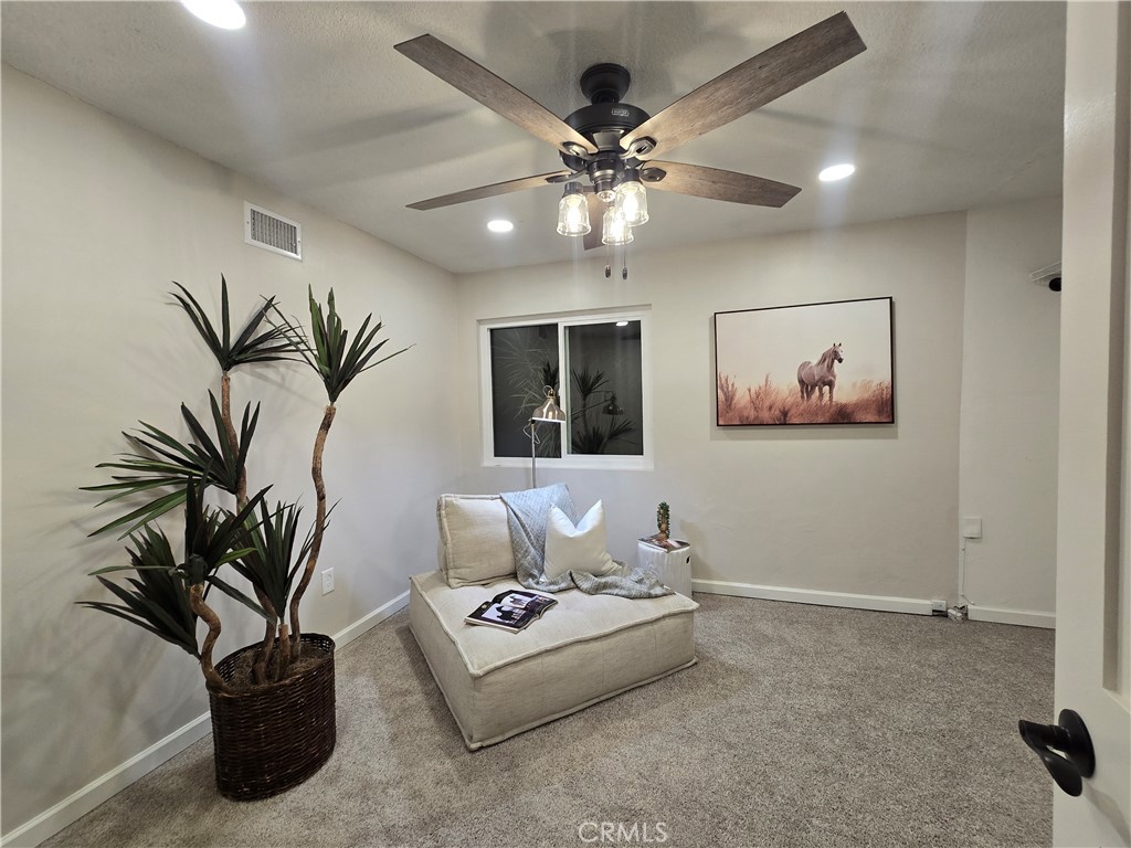 607 Sixth Street Norco, CA 92860 - Photo 16 of 31 a living room with furniture and a potted plant