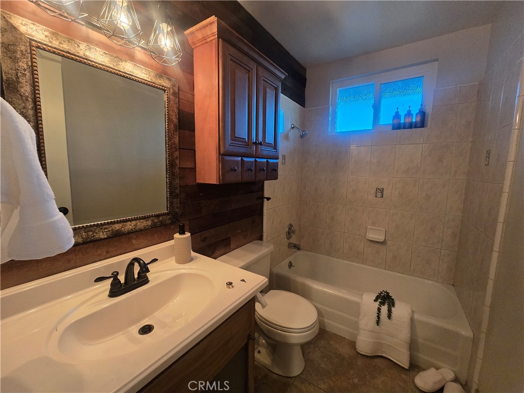 607 Sixth Street Norco, CA 92860 - Photo 18 of 31 a bathroom with a sink toilet and shower