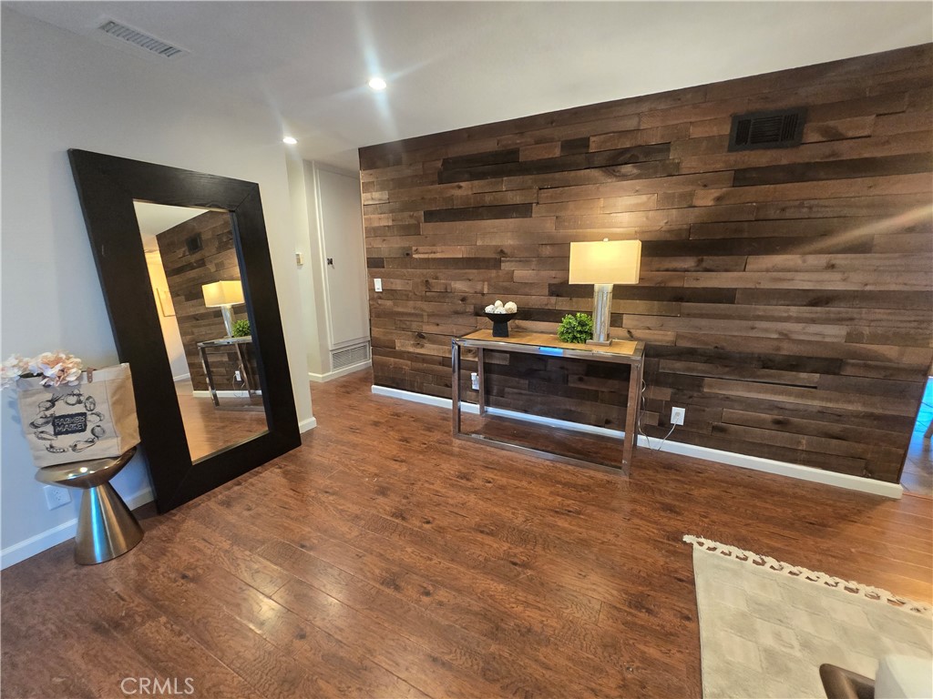 607 Sixth Street Norco, CA 92860 - Photo 2 of 31 a living room with furniture and a wooden floor