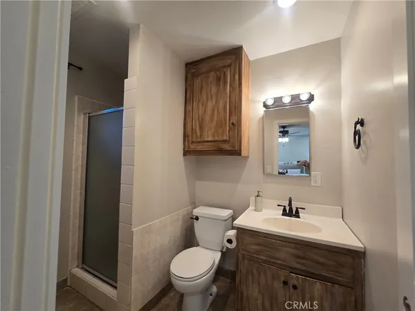 a bathroom with a sink toilet and mirror