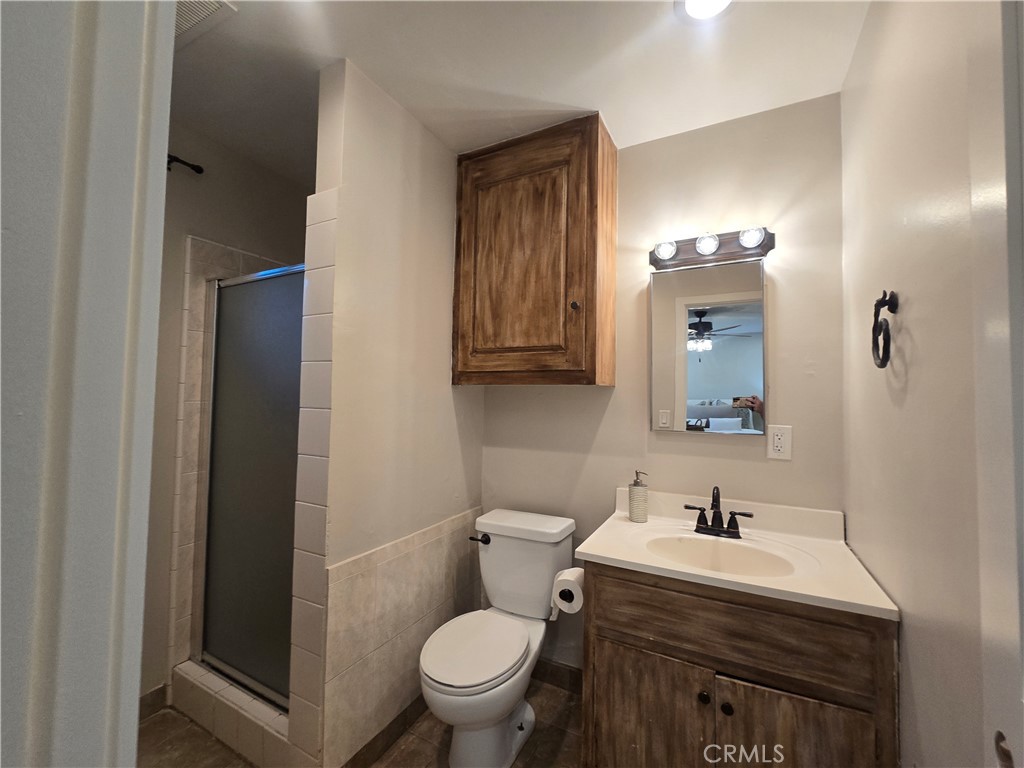 607 Sixth Street Norco, CA 92860 - Photo 22 of 31 a bathroom with a sink toilet and mirror
