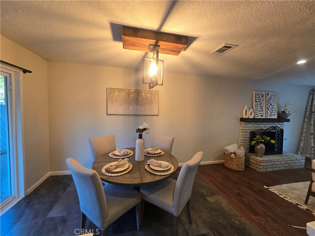 607 Sixth Street Norco, CA 92860 - Photo 8 of 31 a view of a dining room with furniture and wooden floor