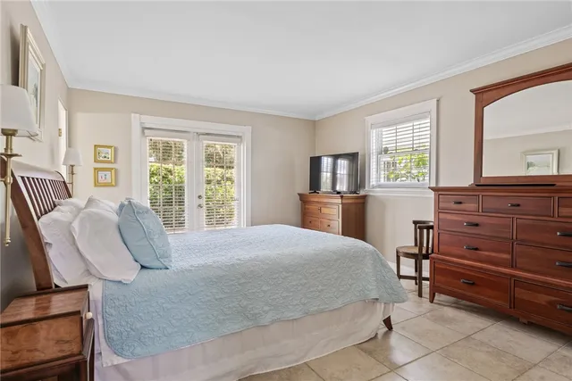 a bedroom with two beds and a window