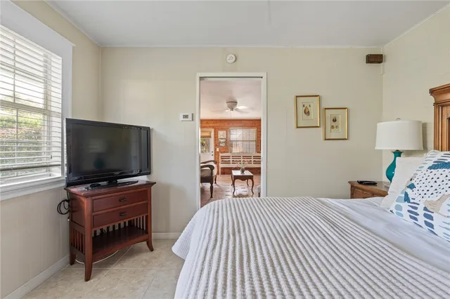 a view of a patio with table and chairs and potted plants