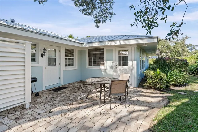 a view of a house with a yard and plants