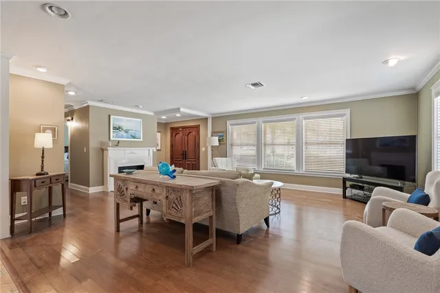 a living room with furniture a fireplace and a table