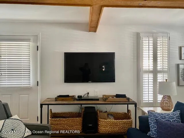 a living room with a couch and a flat screen tv