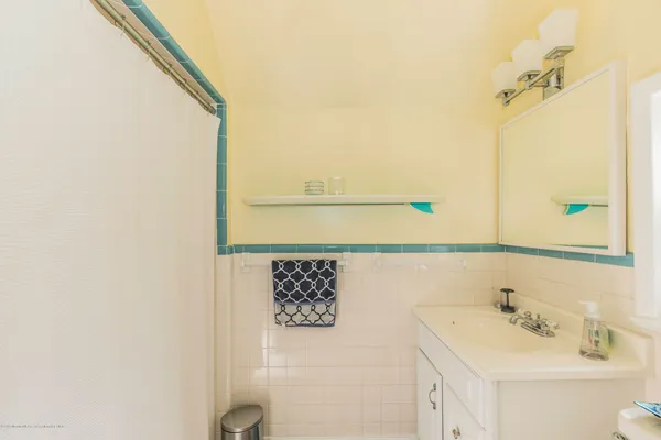 a bathroom with a sink and mirror
