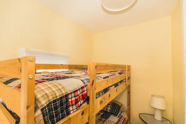 a view of a room with racks on the wall