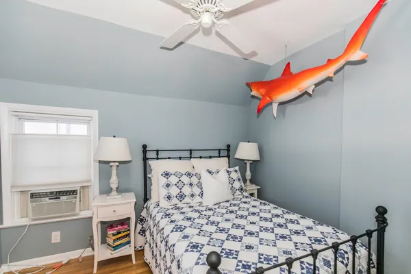 a bedroom with a bed and a dresser