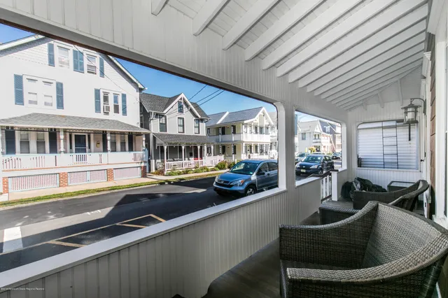 a view of a house with swimming pool and sitting area