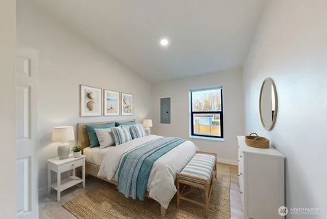 a bedroom with bed and a window