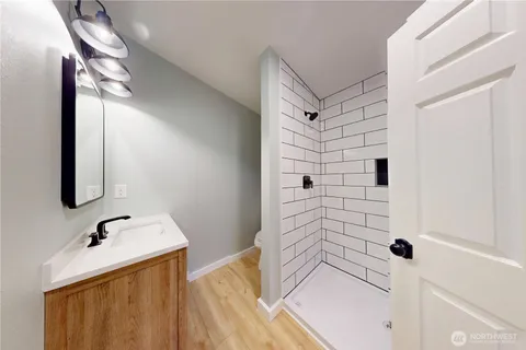 a bathroom with a sink and mirror