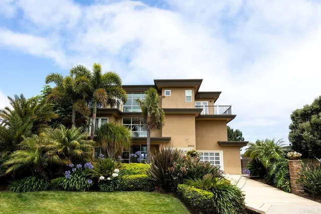 a living room with a table and a fireplace