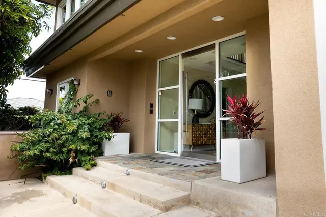 a view of staircase with a table and chairs