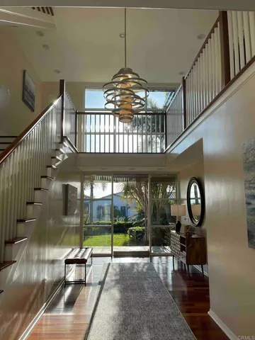 a kitchen with stainless steel appliances kitchen island granite countertop a sink and wooden cabinets