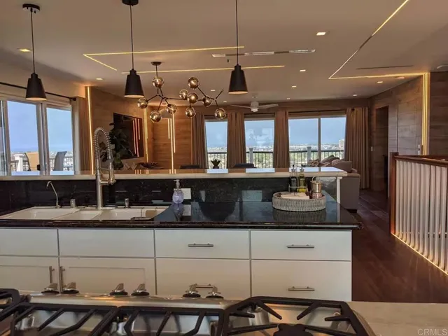 a kitchen with a stove and a refrigerator