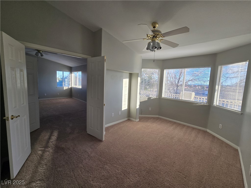Undisclosed Address Las Vegas, NV 89149 - Photo 20 of 34 Unfurnished bedroom featuring dark carpet and ceiling fan