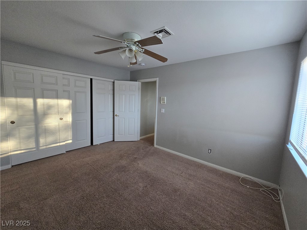Undisclosed Address Las Vegas, NV 89149 - Photo 21 of 34 Unfurnished bedroom featuring a closet, carpet floors, and ceiling fan