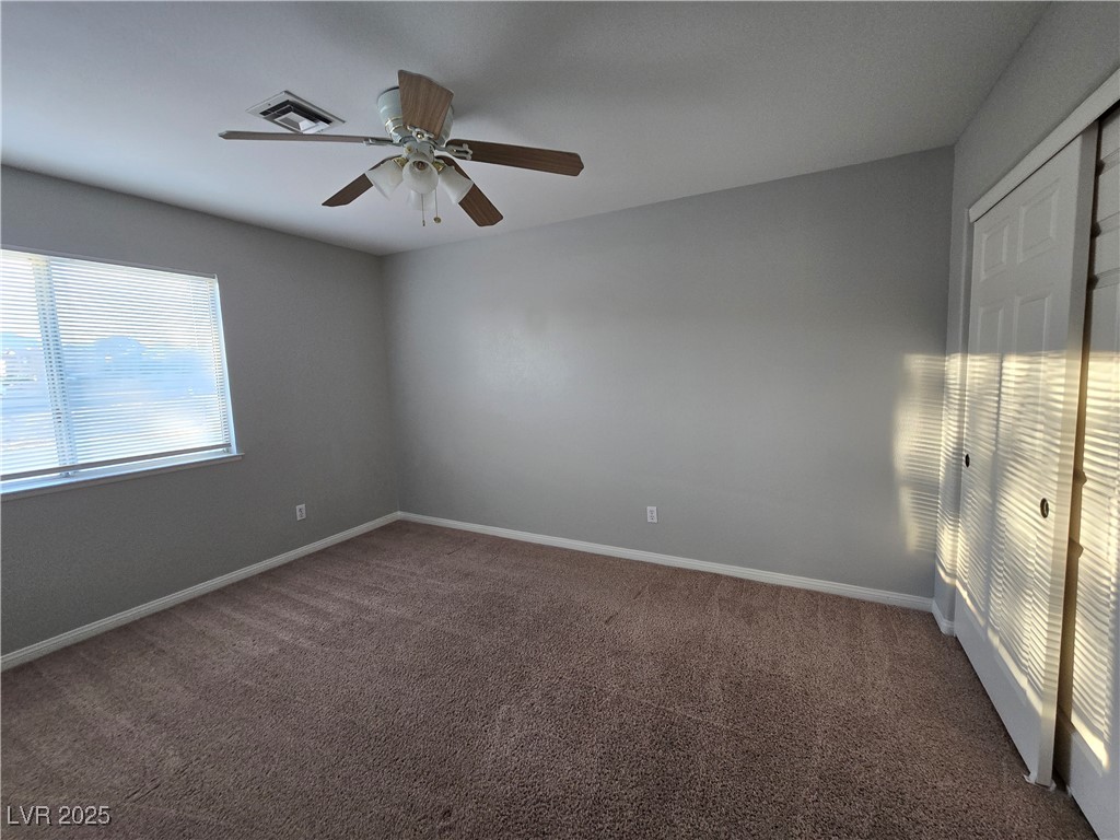 Undisclosed Address Las Vegas, NV 89149 - Photo 22 of 34 Spare room featuring carpet and a ceiling fan