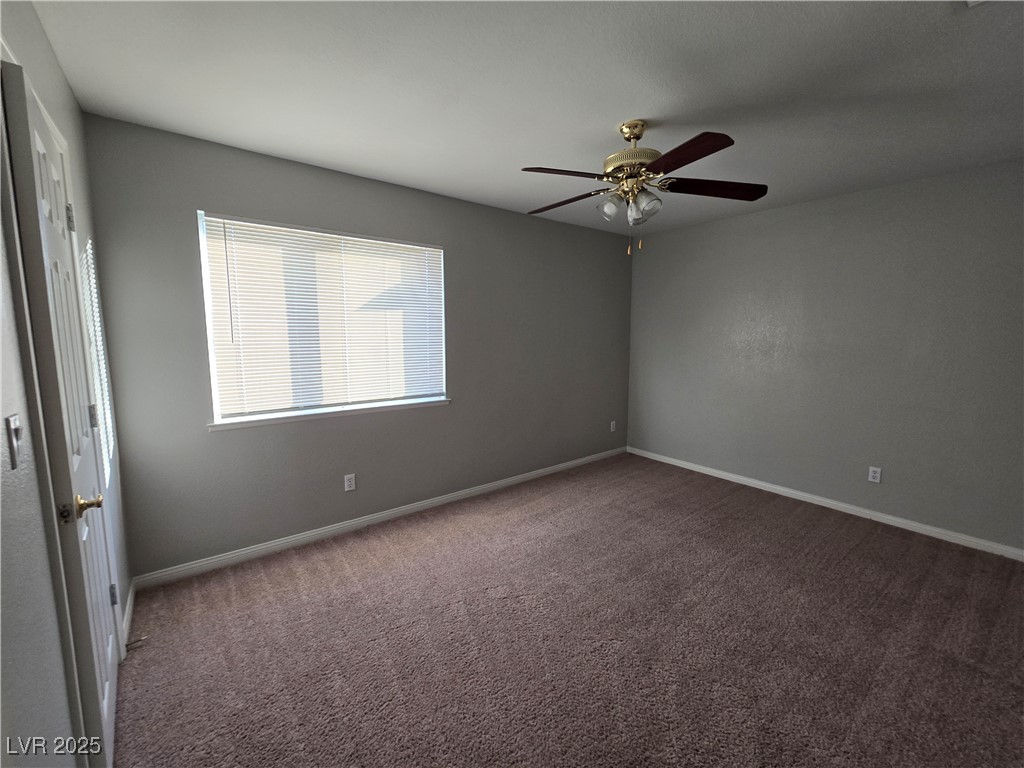 Undisclosed Address Las Vegas, NV 89149 - Photo 26 of 34 Spare room with dark colored carpet and baseboards
