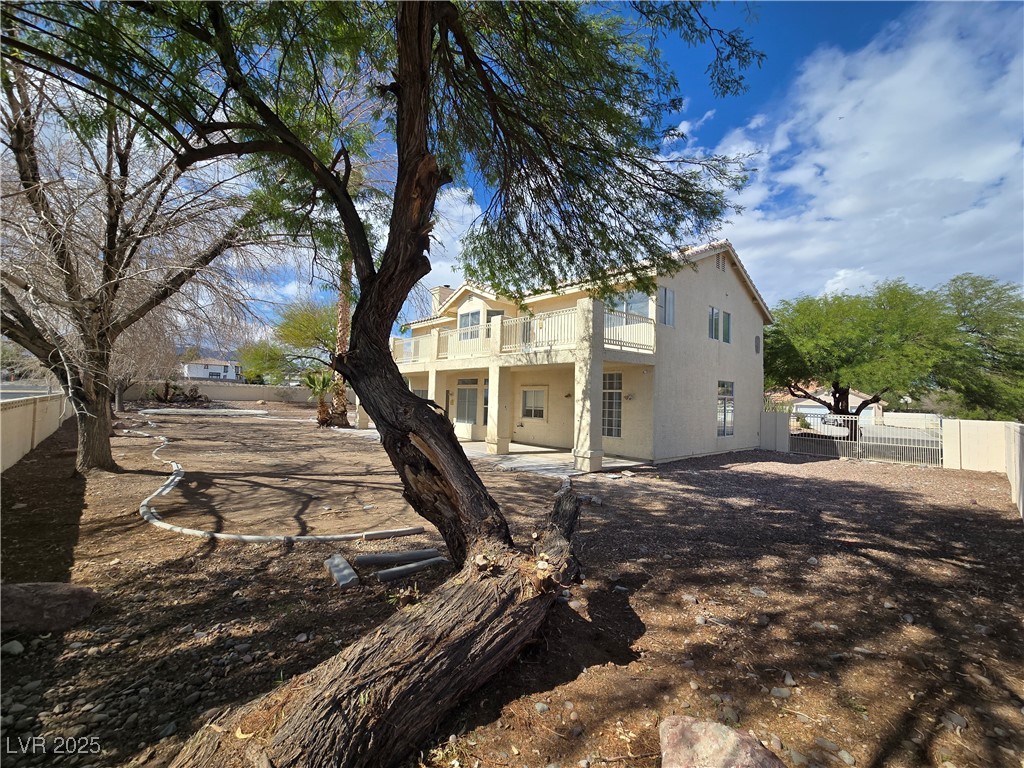 Undisclosed Address Las Vegas, NV 89149 - Photo 31 of 34 Rear view of house with a patio area and a fenced backyard