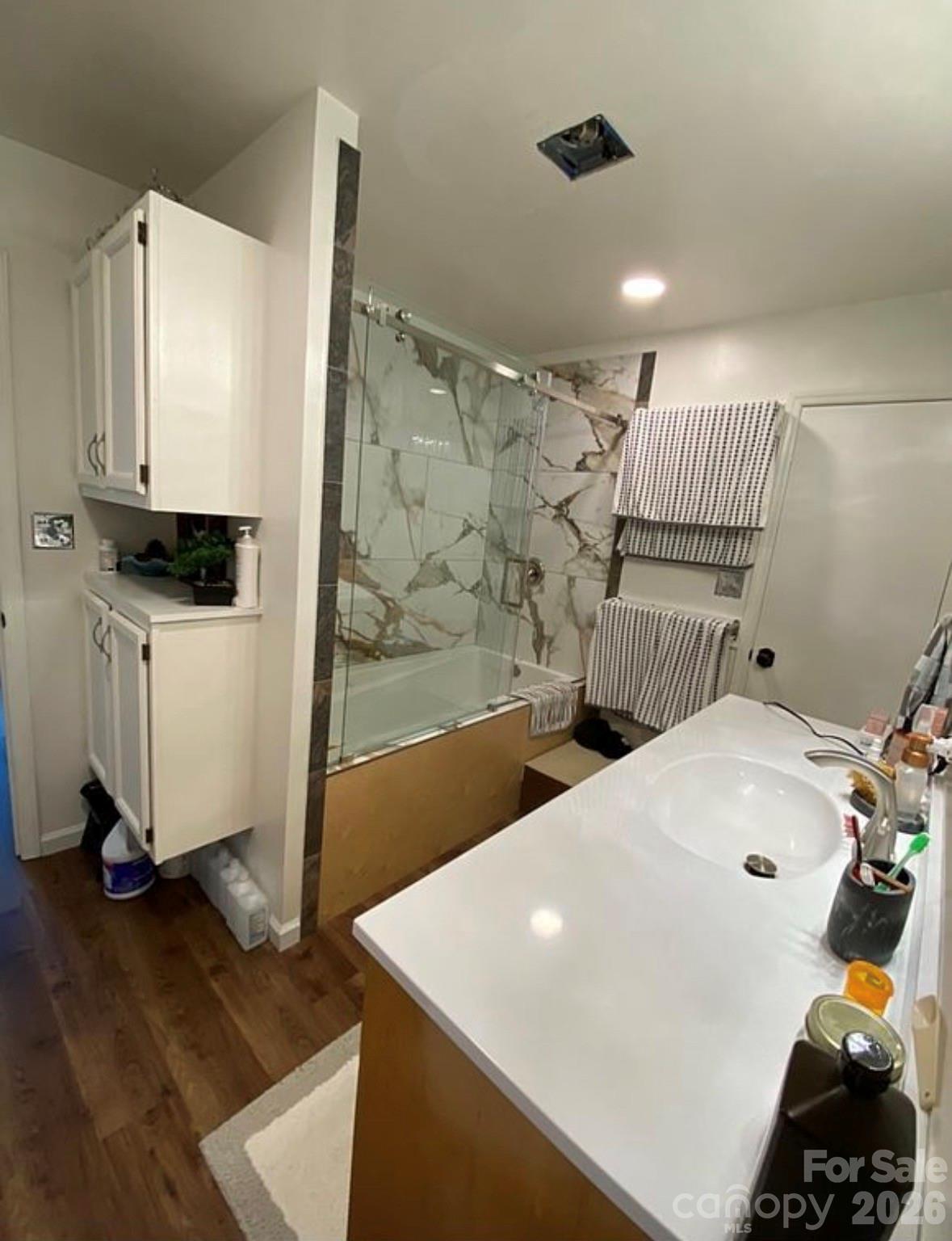 6042 Heavner Road Vale, NC 28168 - Photo 13 of 27 a bathroom with a sink a mirror and a shower