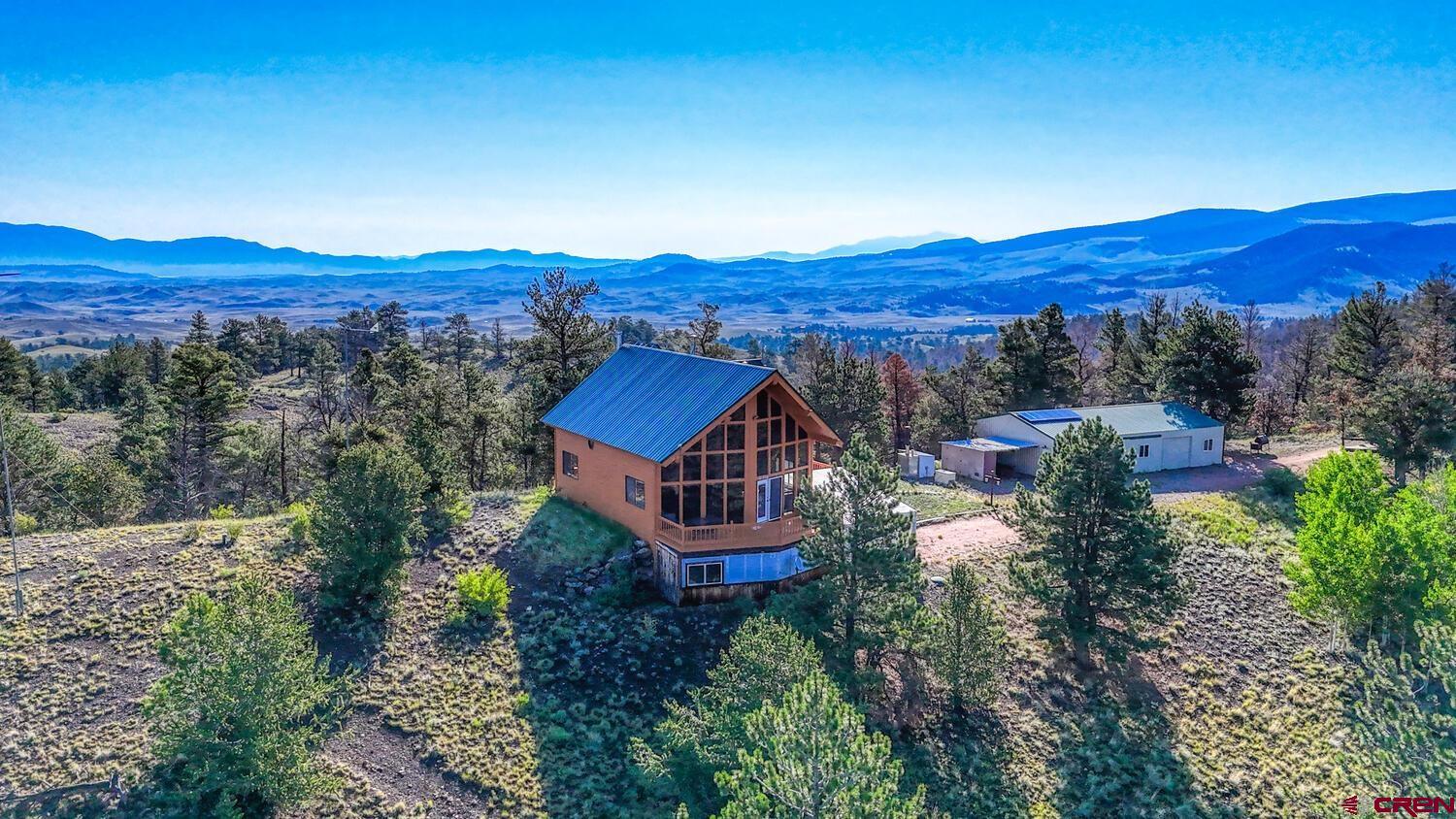 741 Wolfe Road Hartsel, CO 80449 - Photo 2 of 45 an aerial view of a house with mountain view