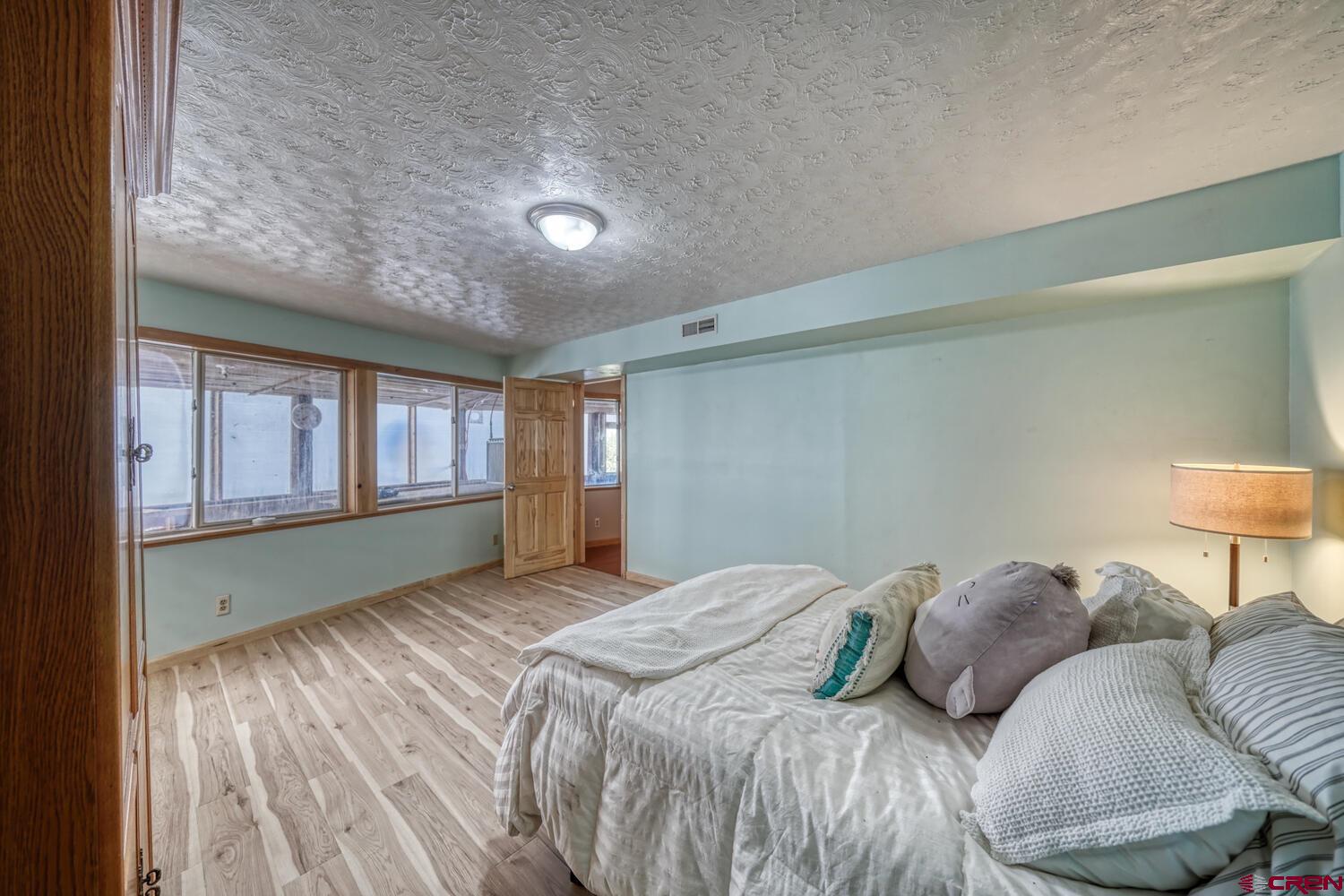 741 Wolfe Road Hartsel, CO 80449 - Photo 22 of 45 a bedroom with a bed and a window