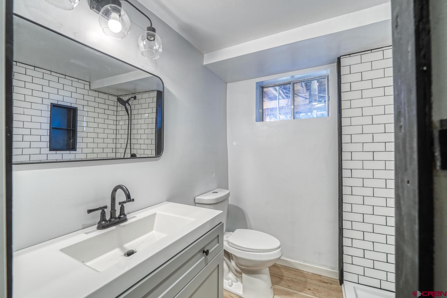741 Wolfe Road Hartsel, CO 80449 - Photo 25 of 45 a bathroom with a sink and a mirror