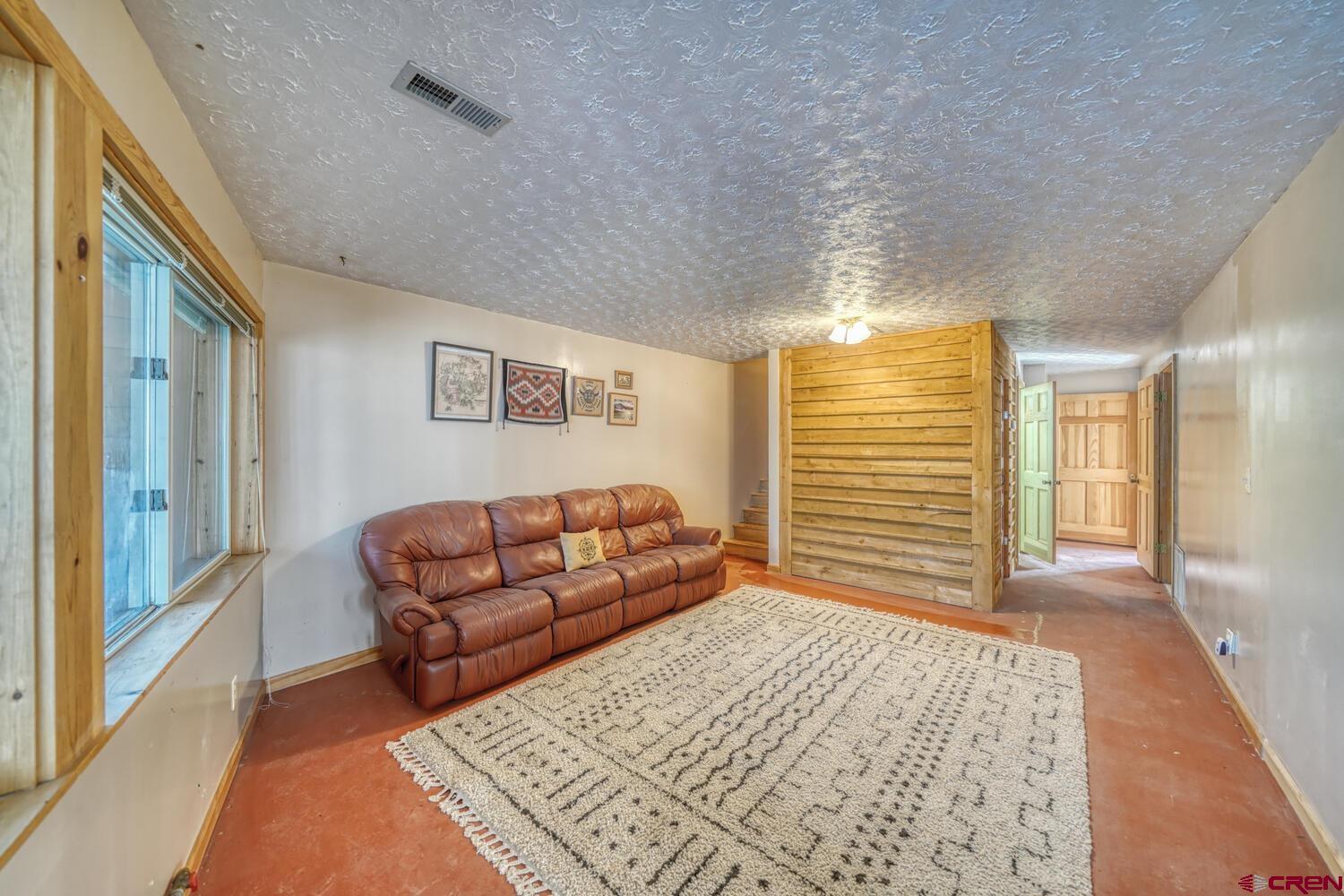 741 Wolfe Road Hartsel, CO 80449 - Photo 28 of 45 a bedroom with furniture and a rug