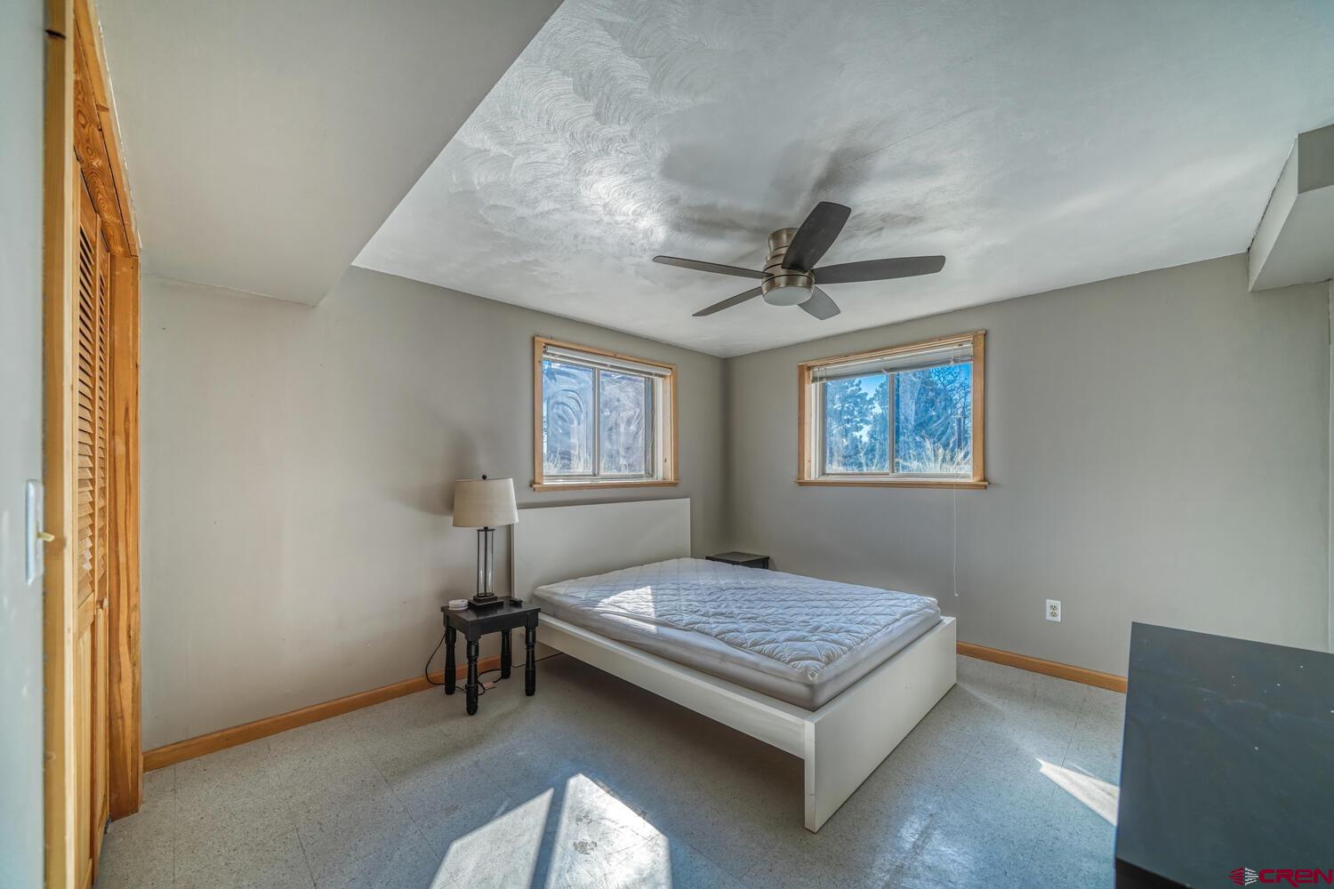 741 Wolfe Road Hartsel, CO 80449 - Photo 29 of 45 a bedroom with a bed and a window