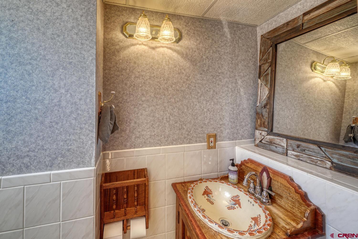 741 Wolfe Road Hartsel, CO 80449 - Photo 31 of 45 a bathroom with a bathtub and a sink