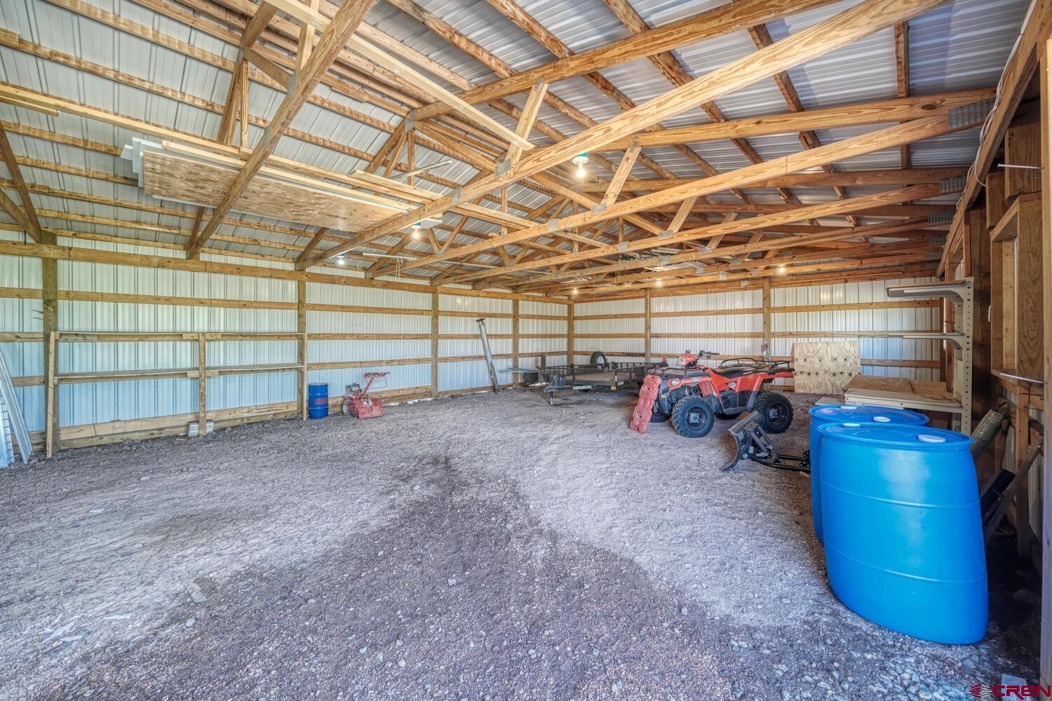 741 Wolfe Road Hartsel, CO 80449 - Photo 42 of 45 a view of a garage with a table and chairs