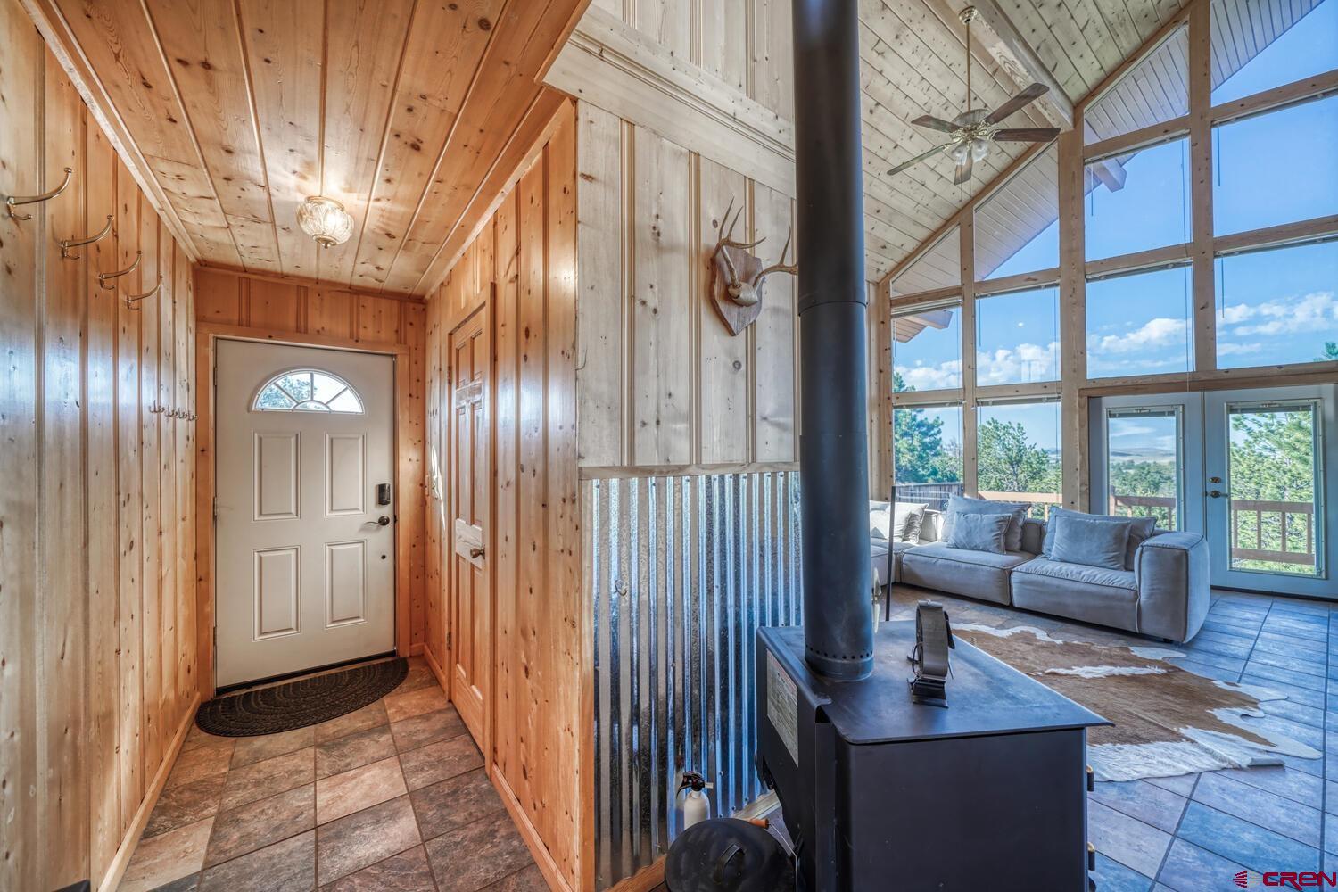 741 Wolfe Road Hartsel, CO 80449 - Photo 5 of 45 a view of entryway and hall with wooden floor