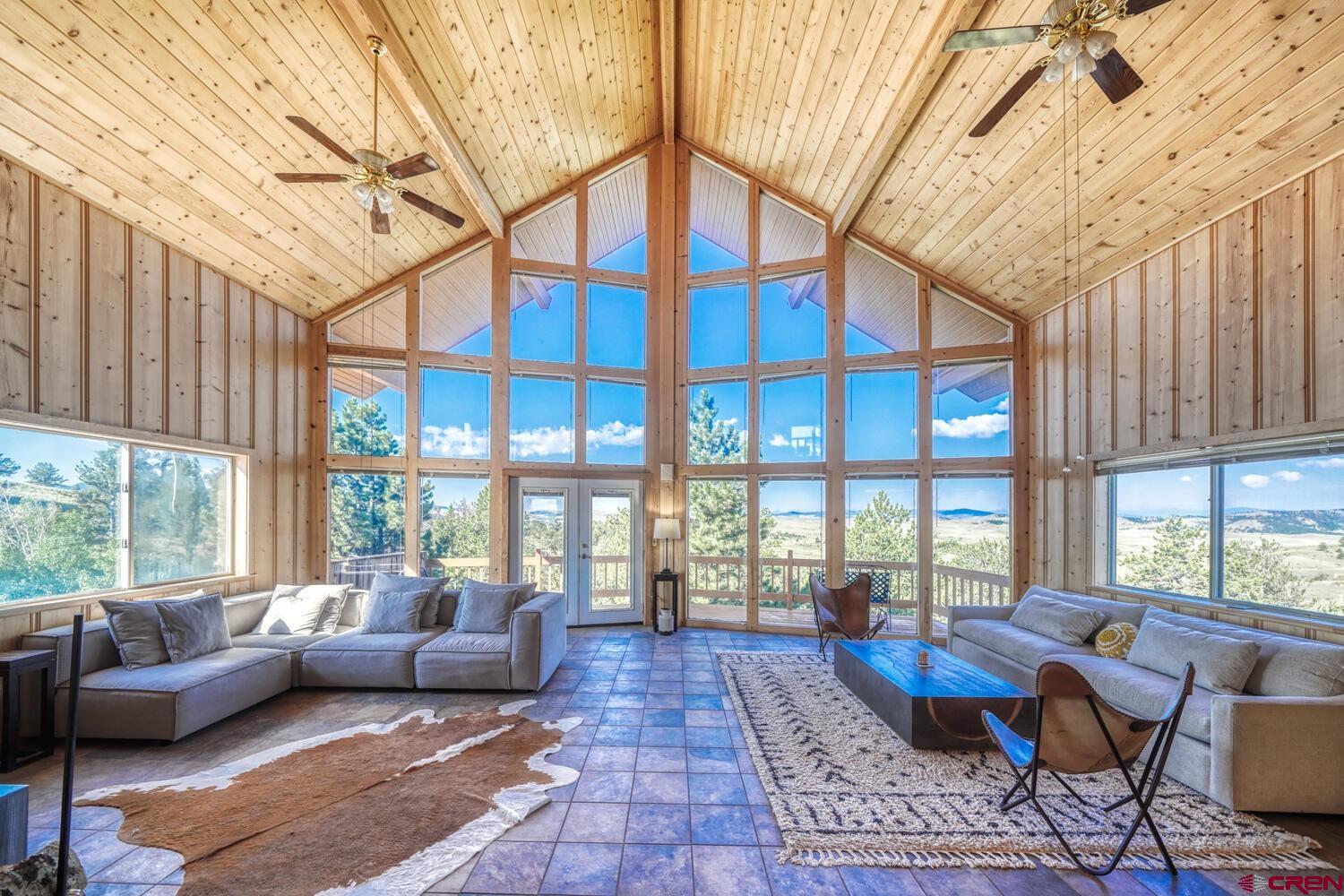 741 Wolfe Road Hartsel, CO 80449 - Photo 6 of 45 a living room with furniture and a large window